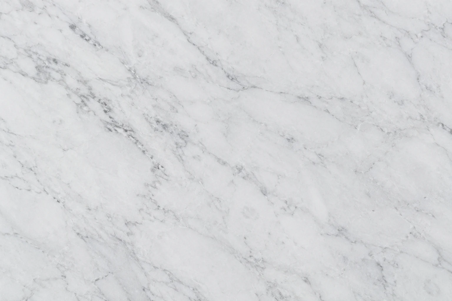 White marble surface with feathered gray veining