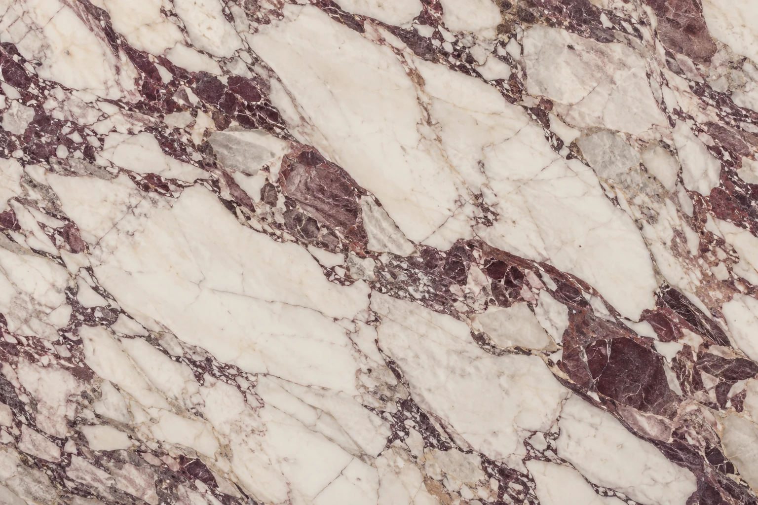 Cream marble surface with burgundy and violet veining