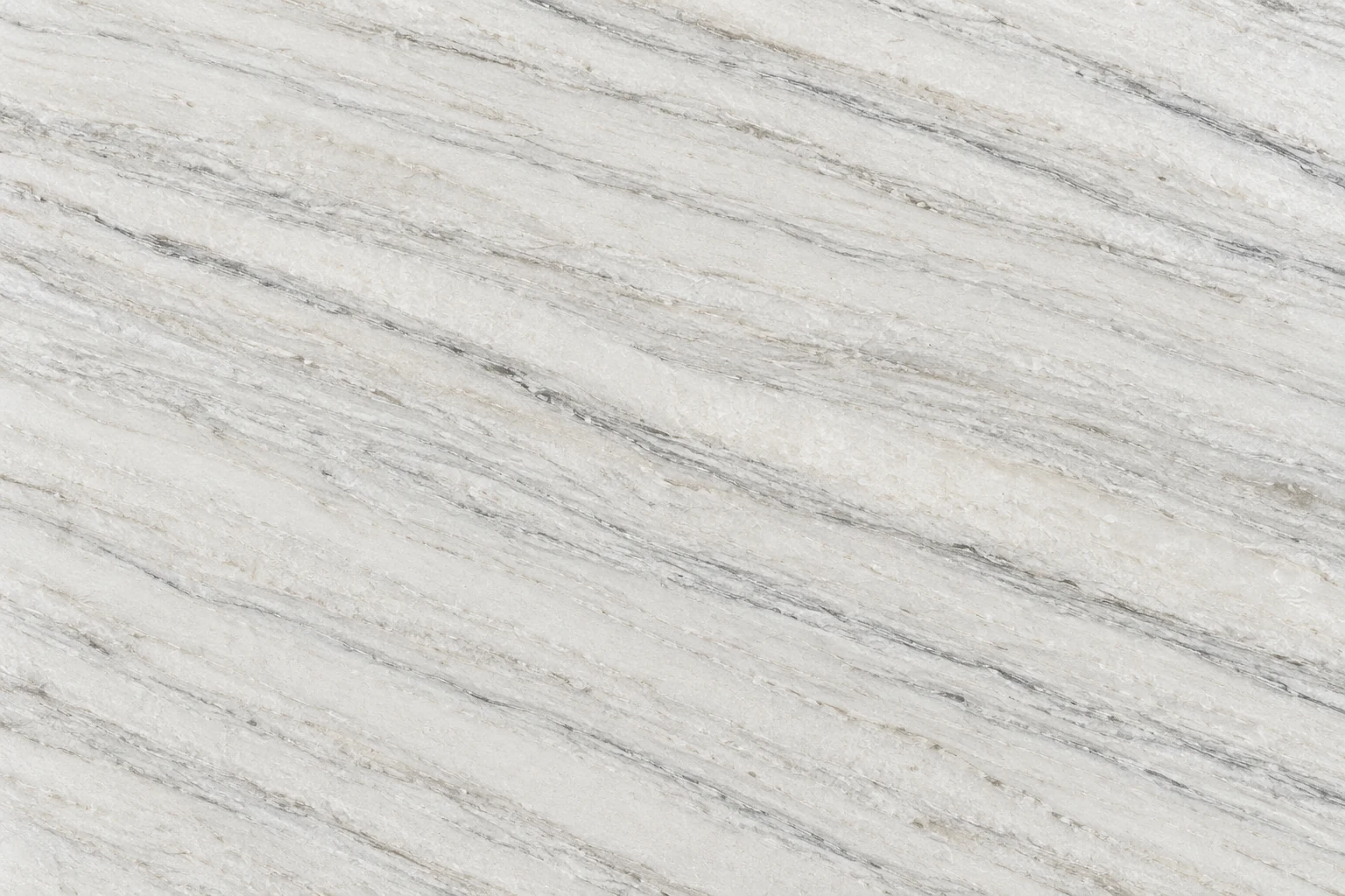 White quartzite surface with directional gray bands